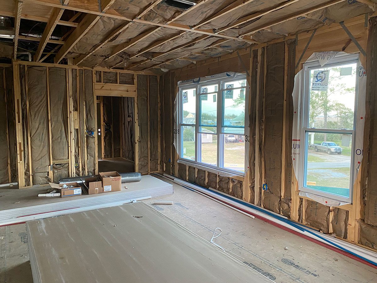 Fiberglass batt insulation install in Mississippi home framing