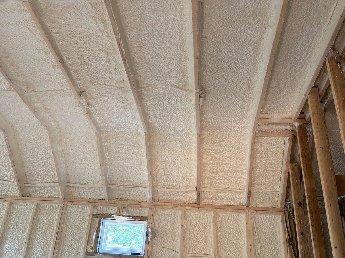 Closed-cell spray foam insulation under elevated home floor system — Mississippi
